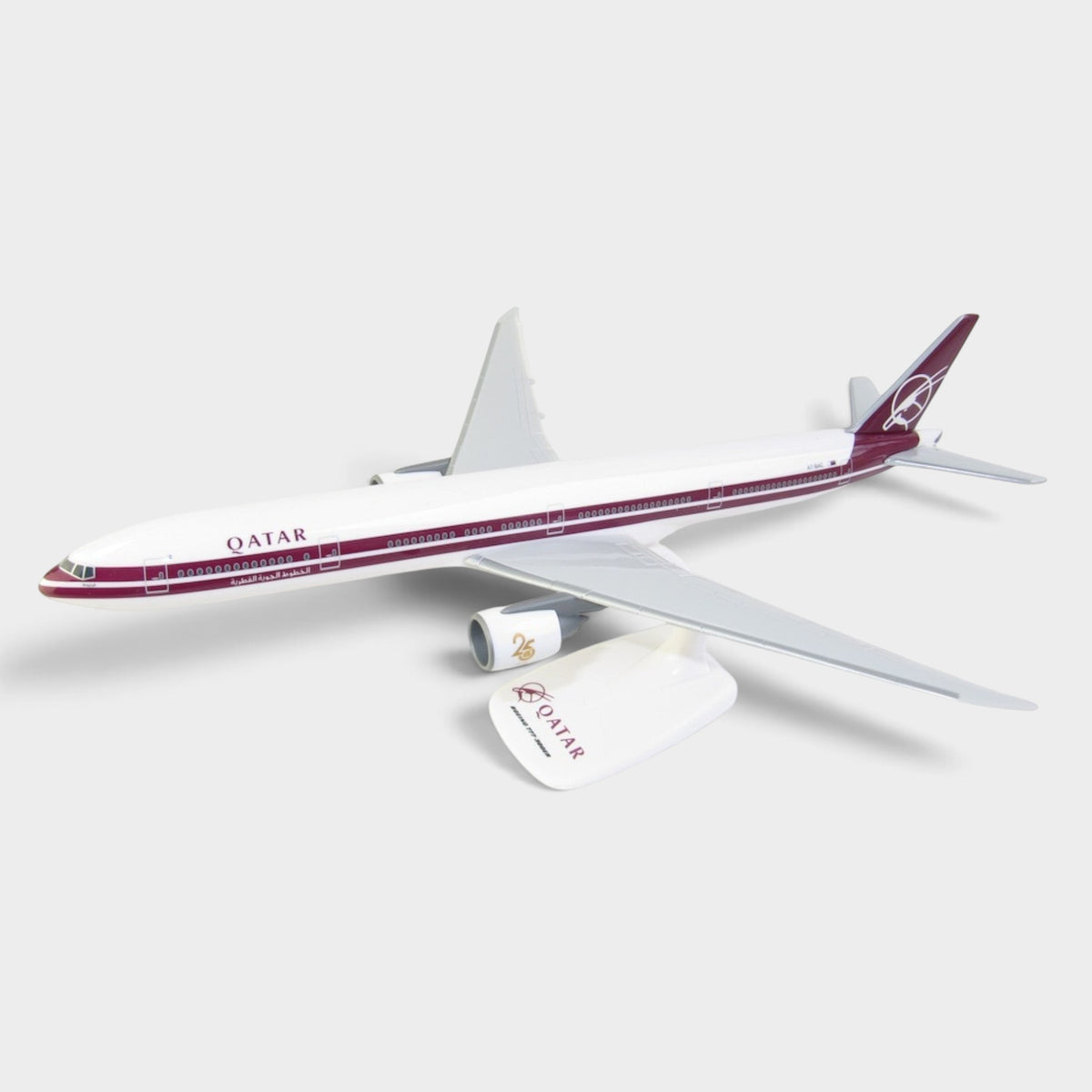 Slice Boeing 777-300ER model plane in Qatar Airways retro livery with A7-BAC registration on a white background