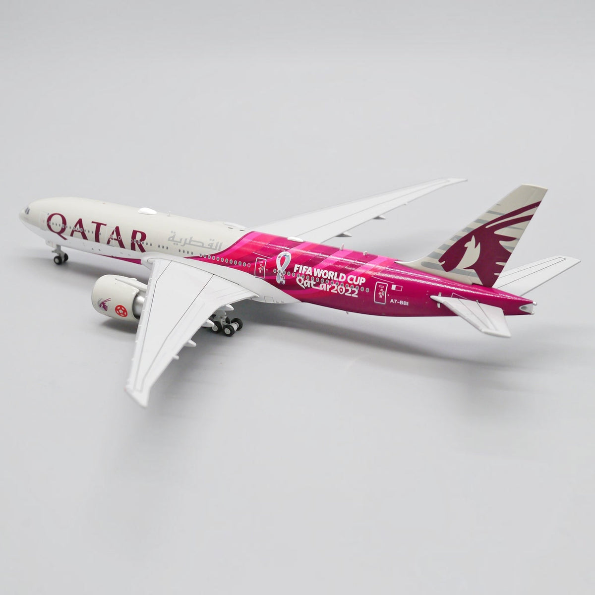 Slice Boeing 777-200LR Qatar Airways FIFA World Cup 2022 diecast model aircraft in 1:400 scale with white and pink livery.