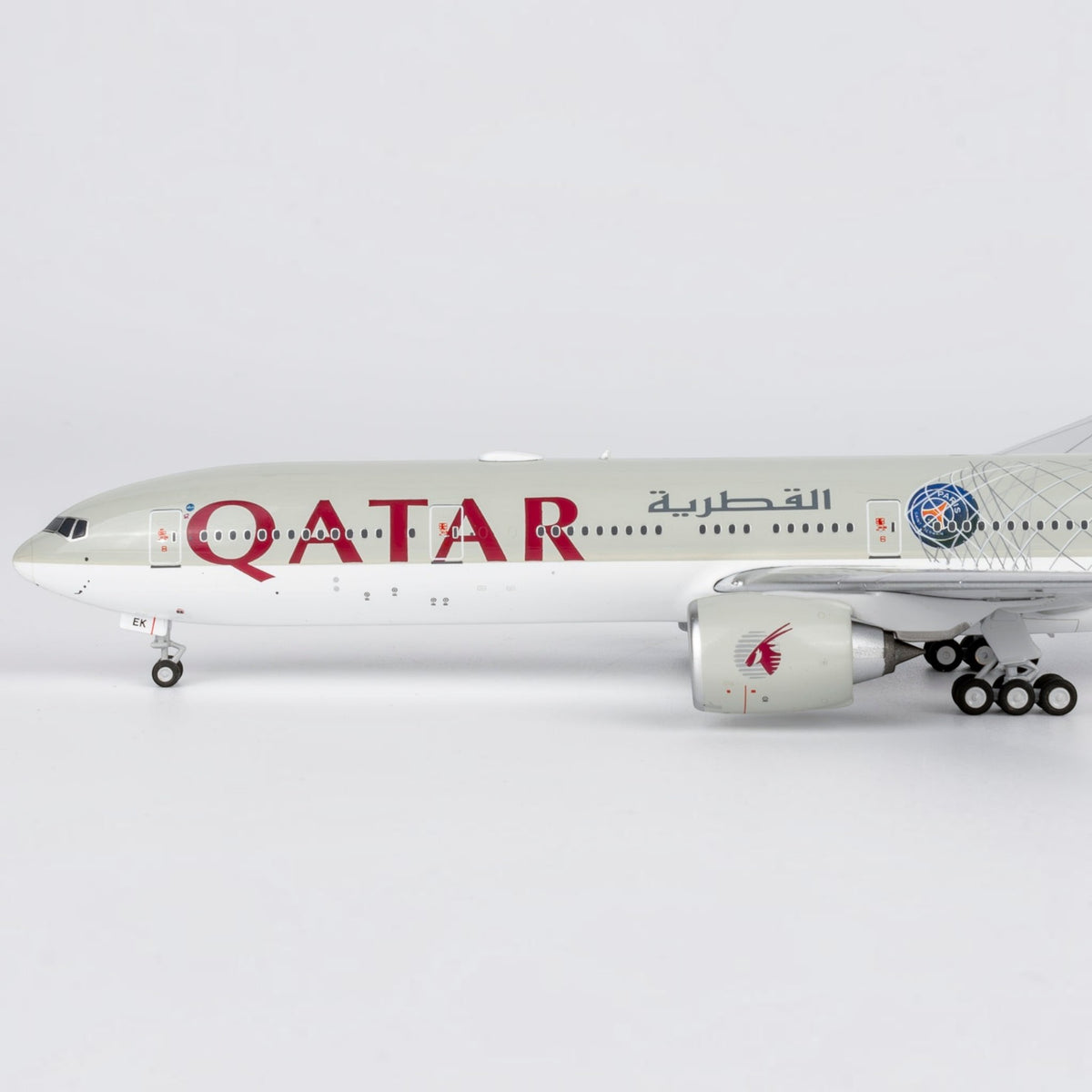 Slice 1:400 scale diecast Boeing 777-300ER model in Qatar Airways Paris Saint Germain livery with detailed markings.