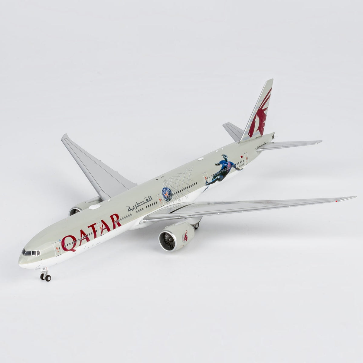 Slice 1:400 scale diecast Boeing 777-300ER model in Qatar Airways Paris Saint Germain livery on a white background