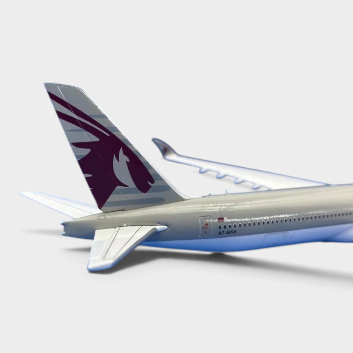 Slice Gemini Jets 1:400 scale diecast Boeing 777-9 Qatar Airways model showing the tail fin and fuselage detail