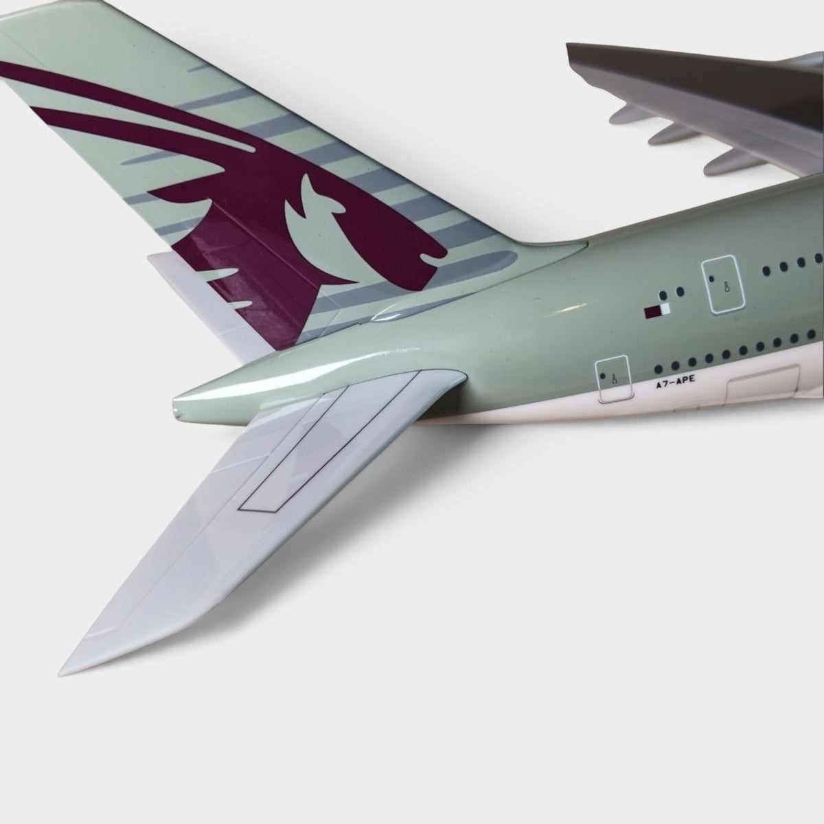 Slice 1:200 scale Qatar Airways Airbus A380 model tail section featuring the iconic burgundy oryx logo