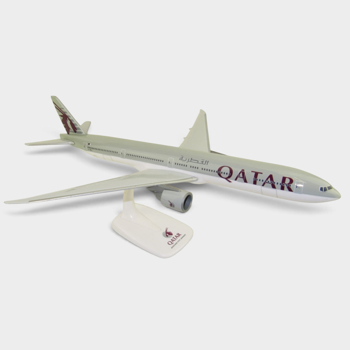 Slice 1:200 scale Qatar Airways Boeing 777-300ER plastic display model with stand and A7-BEJ registration.