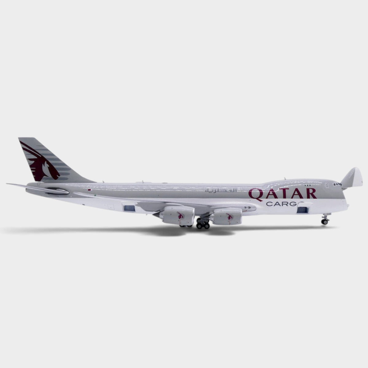 Slice JC Wings 1:400 scale diecast model of a Qatar Airways Cargo Boeing 747-8F freighter with open nose cargo door