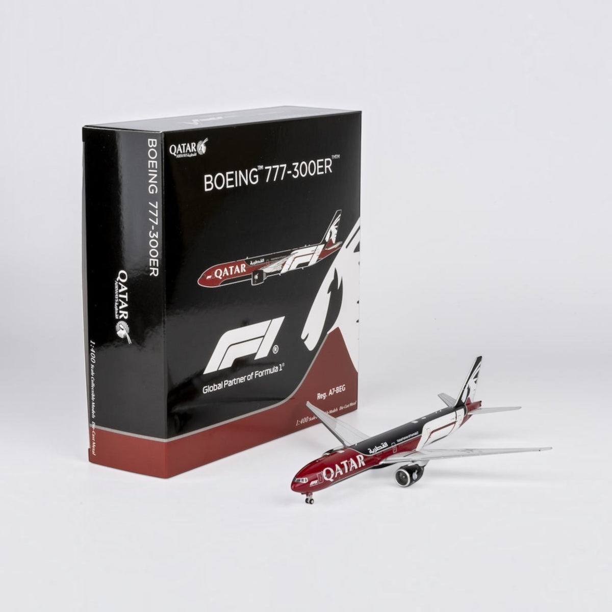Slice 1:400 scale die-cast Qatar Airways Boeing 777-300ER model airplane in Formula 1 livery with presentation box.