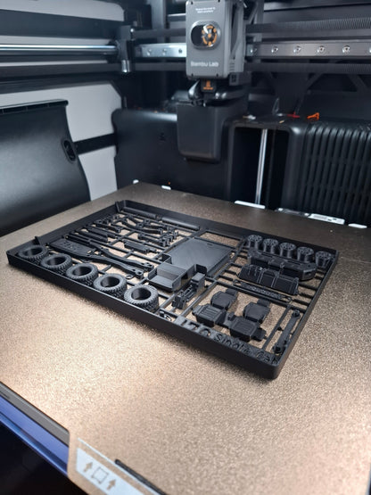 Slice Army Edition Toyota Pickup single cab model kit on a 3D printer bed. Includes tires, chassis, and interior parts.