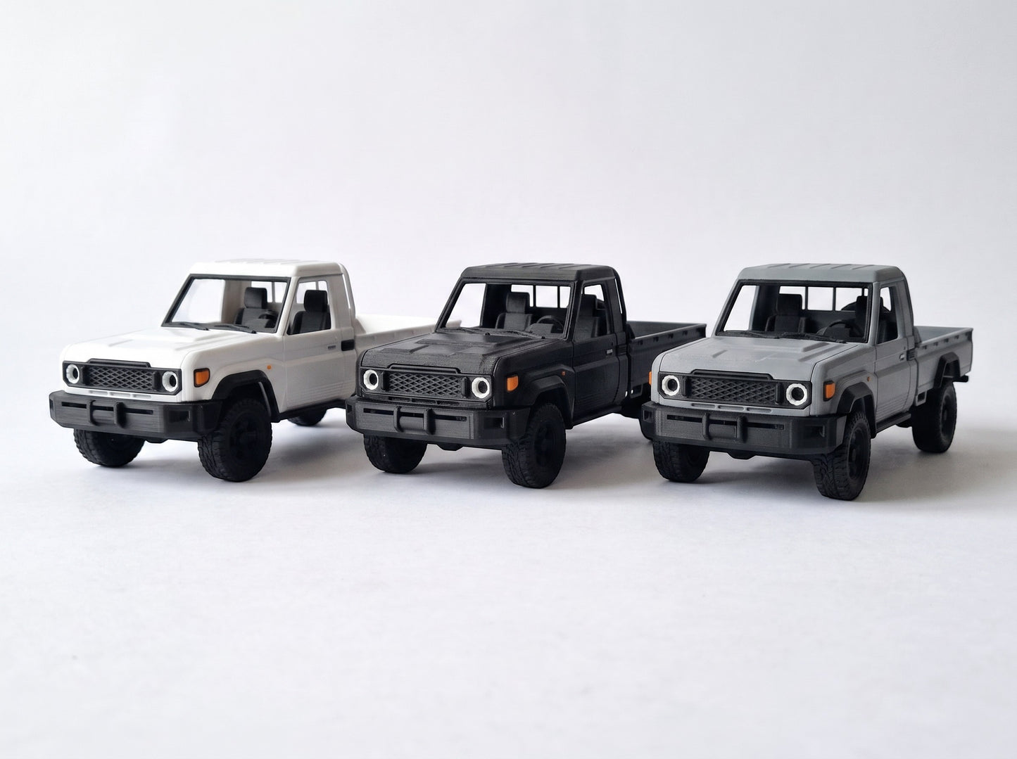 Slice Toyota Pickup Single Cab Army Edition model truck in army green, black, and grey. Highly detailed 3D-printed construction.